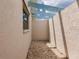 Small, private backyard patio with gravel flooring at 3621 Whippoorwill Blvd, Punta Gorda, FL 33950