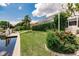 Landscaped backyard with lush greenery, offering privacy and tranquility at 3621 Whippoorwill Blvd, Punta Gorda, FL 33950