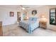 Bright bedroom with a king-size bed and ensuite access at 3621 Whippoorwill Blvd, Punta Gorda, FL 33950