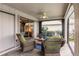 Relaxing patio with wicker furniture and ceiling fan at 3621 Whippoorwill Blvd, Punta Gorda, FL 33950