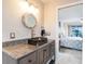 Bathroom with modern vanity, vessel sink, and granite countertop at 3621 Whippoorwill Blvd, Punta Gorda, FL 33950