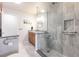 Clean bathroom with granite countertop, walk-in shower, and linen closet at 3621 Whippoorwill Blvd, Punta Gorda, FL 33950