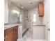 Modern bathroom with granite vanity and a large walk-in shower at 3621 Whippoorwill Blvd, Punta Gorda, FL 33950