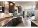 Modern kitchen with stainless steel appliances and dark wood cabinets at 3621 Whippoorwill Blvd, Punta Gorda, FL 33950
