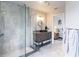 Elegant bathroom with walk-in shower, granite vanity, and bedroom view at 3621 Whippoorwill Blvd, Punta Gorda, FL 33950