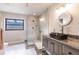 Modern bathroom with walk-in shower, granite vanity, and updated fixtures at 3621 Whippoorwill Blvd, Punta Gorda, FL 33950