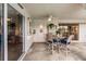 Covered patio with table and chairs, adjacent to kitchen at 3621 Whippoorwill Blvd, Punta Gorda, FL 33950