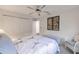 Bright bedroom with double doors and ceiling fan at 3621 Whippoorwill Blvd, Punta Gorda, FL 33950