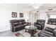 Living room with leather furniture and hardwood floors at 25188 Marion Ave # C301, Punta Gorda, FL 33950