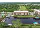 Aerial view of waterfront community with tennis courts and pool at 25188 Marion Ave # C301, Punta Gorda, FL 33950
