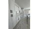 Modern kitchen with white shaker cabinets and marble countertops at 212 Fairway Rd, Rotonda West, FL 33947