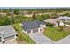 Beautiful home featuring a three-car garage, paver driveway, and nicely manicured lawn at 212 Fairway Rd, Rotonda West, FL 33947