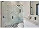 Bathroom showcasing a frameless glass shower with a black rainfall shower head at 212 Fairway Rd, Rotonda West, FL 33947