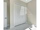 Bedroom features white closet door, white walls, and marble floors at 212 Fairway Rd, Rotonda West, FL 33947