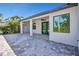 Exterior view of the back of the house showing the covered patio with outdoor kitchen at 212 Fairway Rd, Rotonda West, FL 33947