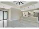 Open concept living room with modern fixtures and bright, marble floors at 212 Fairway Rd, Rotonda West, FL 33947
