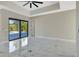 Bright main bedroom with sliding glass doors, and sleek marble floors at 212 Fairway Rd, Rotonda West, FL 33947
