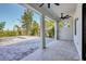 Covered patio features tile flooring, ceiling fan and overlooks the backyard with an unfinished pool at 212 Fairway Rd, Rotonda West, FL 33947