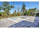 Unfinished in-ground pool surrounded by brick pavers and mature trees at 212 Fairway Rd, Rotonda West, FL 33947