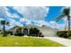 Single-story house with gray roof, screened entry at 515 Allworthy St, Port Charlotte, FL 33954