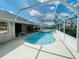 Inviting screened pool area with a spacious patio at 515 Allworthy St, Port Charlotte, FL 33954