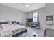 Bedroom with double bed, dresser, and large window at 16195 Maya Cir, Punta Gorda, FL 33955