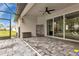 Covered patio with pavers and sliding glass doors at 16195 Maya Cir, Punta Gorda, FL 33955