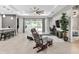 Open living space with a TV, comfortable seating, and views of the pool area at 16195 Maya Cir, Punta Gorda, FL 33955
