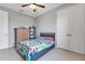 Bedroom with double bed, shelving, and a ceiling fan at 16195 Maya Cir, Punta Gorda, FL 33955