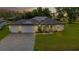 One-story house with solar panels and a paved driveway at 16195 Maya Cir, Punta Gorda, FL 33955
