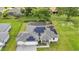 Aerial view of a single-Gathering home with solar panels, pool, and landscaped yard at 16195 Maya Cir, Punta Gorda, FL 33955