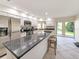 Spacious kitchen featuring granite countertops and stainless steel appliances at 695 Coronado Dr, Punta Gorda, FL 33950