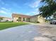 Single-story home with a well-maintained lawn at 695 Coronado Dr, Punta Gorda, FL 33950
