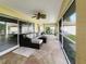 Spacious screened porch, perfect for relaxing with outdoor furniture at 695 Coronado Dr, Punta Gorda, FL 33950