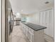 Kitchen with island, stainless steel appliances, and granite counters at 695 Coronado Dr, Punta Gorda, FL 33950