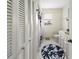 Clean bathroom with white cabinets and a hex tile floor at 695 Coronado Dr, Punta Gorda, FL 33950