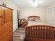 Bright bedroom with wood furniture and a ceiling fan at 695 Coronado Dr, Punta Gorda, FL 33950