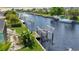 View of canal with boat slips and lush landscaping at 695 Coronado Dr, Punta Gorda, FL 33950