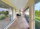 Relaxing screened porch with tiled flooring and outdoor seating at 695 Coronado Dr, Punta Gorda, FL 33950