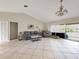 Bright living room with vaulted ceiling and tiled floors at 695 Coronado Dr, Punta Gorda, FL 33950