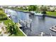View of canal with boat slips and lush landscaping at 695 Coronado Dr, Punta Gorda, FL 33950