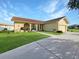 Front view of a single-story house with a two-car garage at 695 Coronado Dr, Punta Gorda, FL 33950