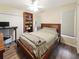 Well-lit bedroom with a wood bed frame and ample storage at 695 Coronado Dr, Punta Gorda, FL 33950