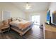 Spacious bedroom with king-size bed, nightstand and sliding glass door to patio at 695 Coronado Dr, Punta Gorda, FL 33950