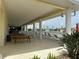 Relaxing clubhouse patio overlooking the pool and community at 2140 Heron Lake Dr # 204, Punta Gorda, FL 33983