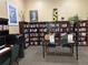 Community library with bookshelves, computer, and printer at 2140 Heron Lake Dr # 204, Punta Gorda, FL 33983