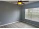 Bright bedroom with wood-look floors and large window at 2140 Heron Lake Dr # 204, Punta Gorda, FL 33983