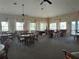 Community room with tables, chairs, and a pool table at 2140 Heron Lake Dr # 204, Punta Gorda, FL 33983