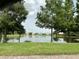 Scenic lake view with lush landscaping and homes at 2140 Heron Lake Dr # 204, Punta Gorda, FL 33983