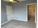 Bedroom with laminate flooring and access to bathroom at 2140 Heron Lake Dr # 204, Punta Gorda, FL 33983